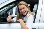 Happy_Woman_Driving_A_New_Car-590x393.jpg